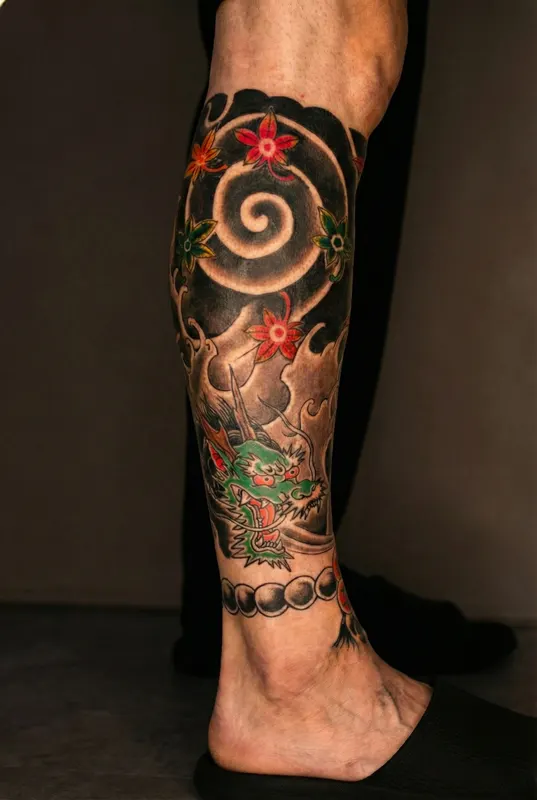 Dragon and maple leaves traditional Japanese tattoo