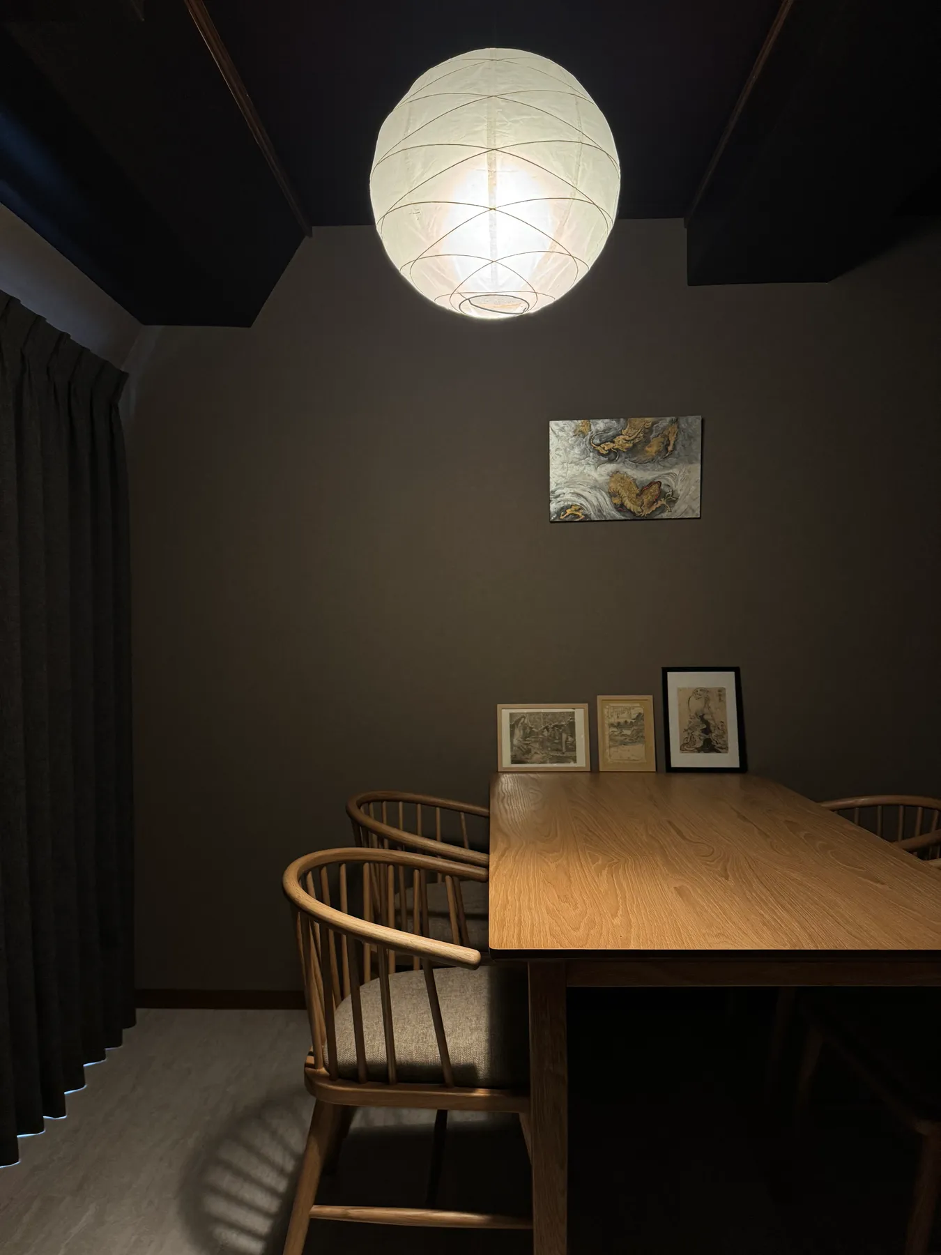 Consultation space with a washi lantern and ukiyo-e prints at Evis Ink Tokyo